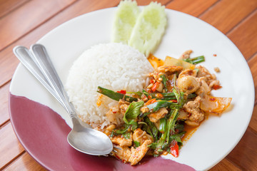 Rice topped with stir-fried pork and basil