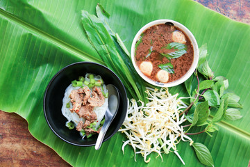 noodle soup on green leaf