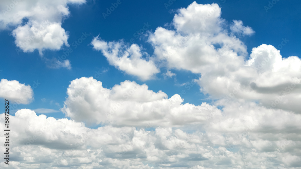 Wall mural clouds in the blue sky nature background landcape.