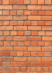 Weathered old British red brick wall background.
