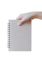 Hand holding notebook on white background