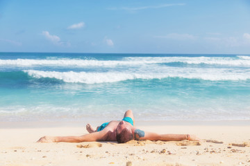 Man enjoying on empty tropical exotic beach.