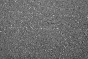 Asphalt background texture with some fine grain with road