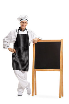 Chef standing by a blank blackboard