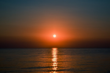Beautiful sunset. The sun sets over the sea.