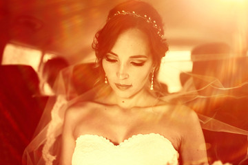 Bride in a white dress at a wedding is beautifully solemn