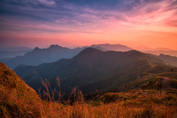 Sunset scene with the peak of mountain and cloudscape at Phu chi fa in Chiang rai, Thailand