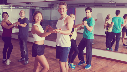 Fototapeta premium Dancing couples learning salsa