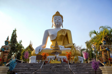 Fototapeta premium Buddha statue Wat Phra That Doi Kham at Chiang Mai,Thai temple Northern Thailand
