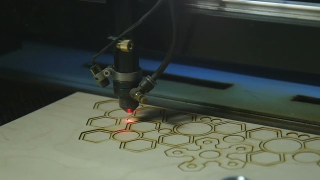 Machine for cutting plywood with a laser