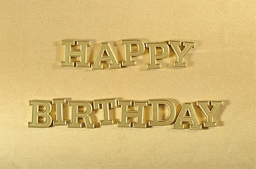 Happy birthday golden text on a golden