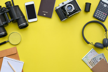 Flat lay of accessories on yellow desk background