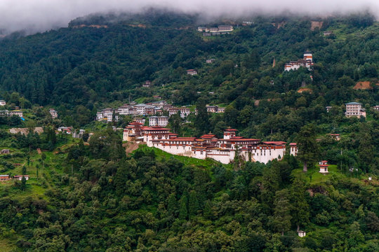 View of Trongsa Dzong and Ta-Dzong with foggy hills, Bumthang, Bhutan, Asia.