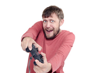 Portrait of adult bearded man holding joystick and playing videogames, isolated on white background