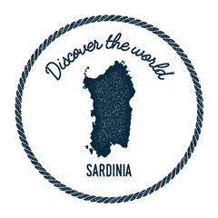 Fototapeta premium Sardinia map in vintage discover the world insignia. Hipster style nautical postage stamp, with round rope border. Vector illustration.