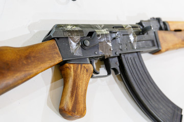 Kalashnikov rifle wrapped in scotch is on the table