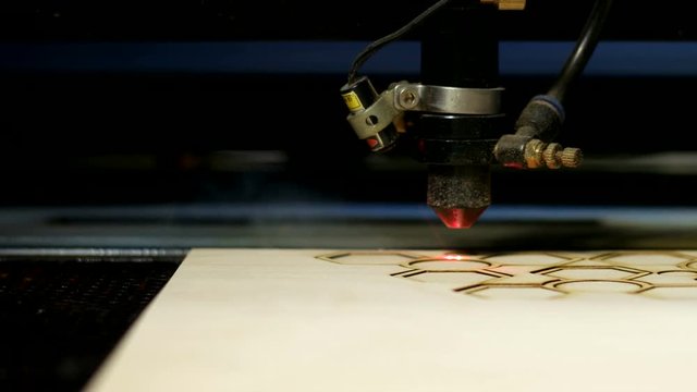 Side view laser cutting on wood