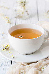 Fresh herbal tea with blooming brunch