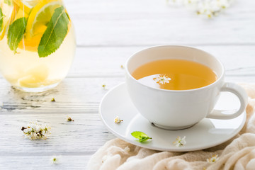 Fresh herbal tea with blooming brunch