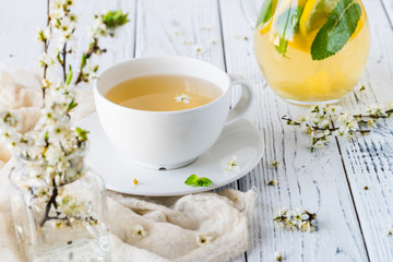 Fresh herbal tea with blooming brunch