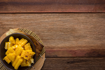 Fototapeta premium split corn on wood background