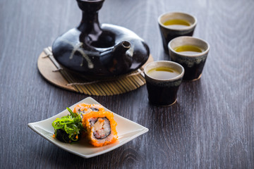 Fototapeta na wymiar tea set and sushi
