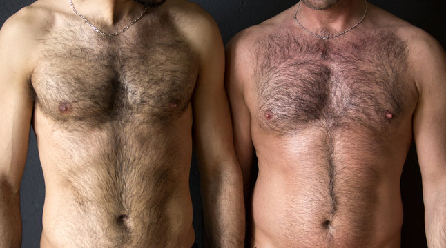 two men with naked chest standing together