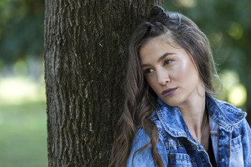 Portrait of a young beautiful woman who pensive