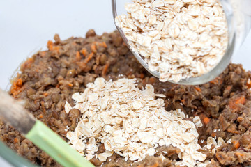 Lentil Burger Preparation : Adding oats to mashed lentils mix to prepare lentils burger