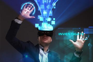 Business, Technology, Internet and network concept. Young businessman working in virtual reality glasses sees the inscription: Investigate