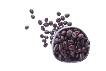 coffee beans in ceramic cup isolated in white background (focus coffee beans on floor)