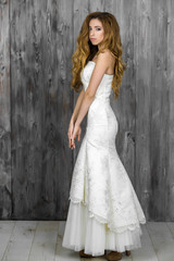 Fototapeta na wymiar Beautiful girl in white evening dress