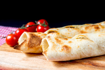 Mexican fajita wraps with grilled chicken fillet and fresh vegetables