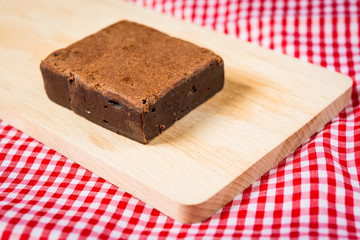 Chocolate Brownie cake on a dark plate