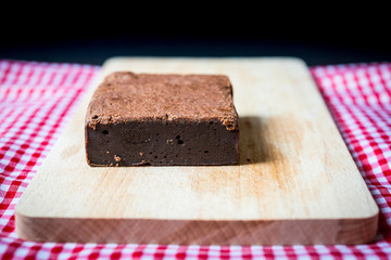 Chocolate Brownie cake on a dark plate