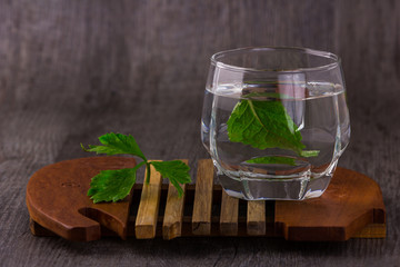 water in glass old wood background