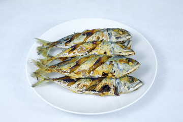 .Fried Short-bodied mackerel in white background, Thai food.