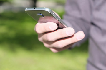 Male hand holding a mobile phone