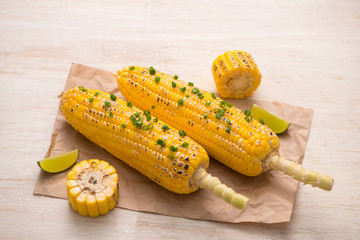 Tasty sweet grilled corn with onion sauce