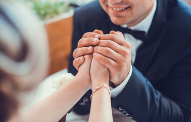 bride and groom holding