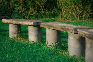 Old concrete bench on grass 