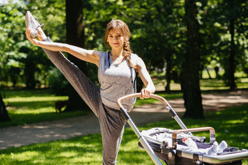Series of exercises with a stroller - young gorgeous mother with baby stroller workout in the park. Sport, maternity, healthy lifestyle concept