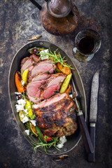 Barbecue Lamb Roast with Vegetable and Feta as close-up in a casserole
