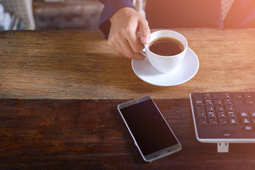 coffee cup clock and work on table