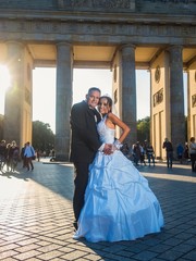 Smiling newlywed couple at Brandenburger Gate in Berlin © arianarama