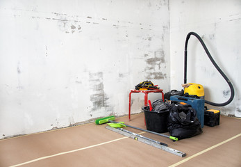 Room renovation. Vacuum cleaner and tools.