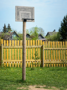 Basketball basket in garden on farm the background of the fence