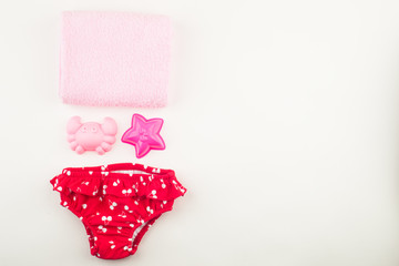 Set for bath or swimming for girl baby. On white background.Top view. Flat lay
