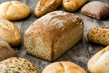 Mixed breads on wooden table
