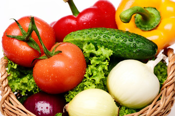 organic food concept, lettuce, tomatoes, onions, peppers, cucumber in basket